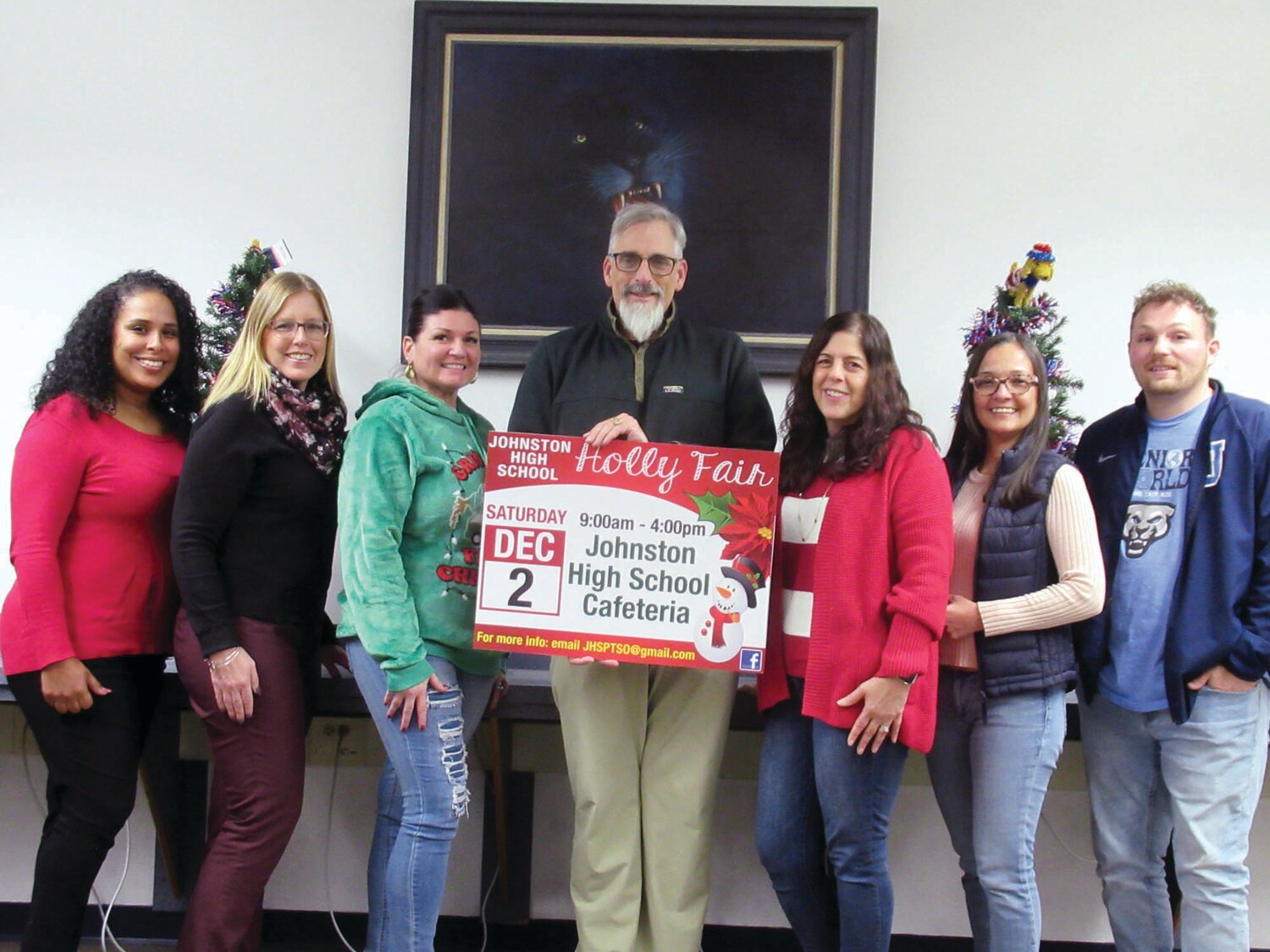 FAIR FOLKS: Lance Niles (center), president of the Johnston PTSO, holds a special sign made by Bori Graphics for this Saturday’s Holily Fair. He’s joined by committee member Lina Cruz, Rachel Salvatore, Tiffany DiBiasio, Angela Niles, Susana Cuellar-Daza and Mike Harwood.